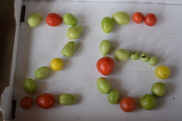number 26 formed from tomatoes