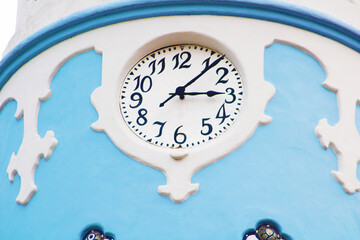 Clock on the fasade of the Hungarian Secessionist Catholic cathedral or the Blue Church in the old town in Bratislava, Slovakia. - obrazy, fototapety, plakaty