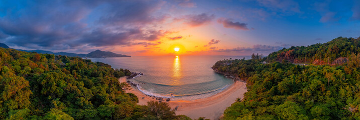 Aerial top view panorama sunset Laem Sing beach with sea of Phuket paradise. Concept tropical travel photo Surin, Thailand