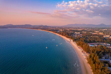 Aerial top view panorama sunset Surin beach with sea of Phuket paradise. Concept tropical travel...