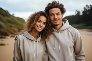 young couple posing outdoors in white hoodie product images