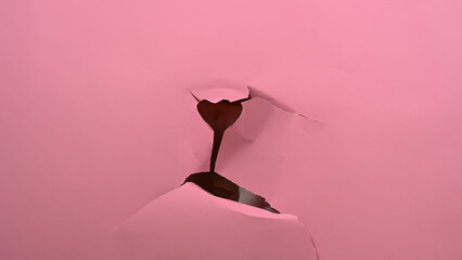 Torn pink paper background. Copy space. 