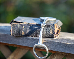 old bible and horse bit