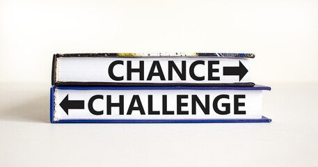 Challenge or chance symbol. Concept word Challenge or Chance on beautiful books. Beautiful white table white background. Business and challenge or chance concept. Copy space.