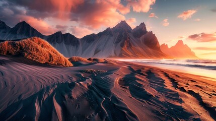 Vestrahorn mountaine on Stokksnes cape in Iceland during sunset. Amazing Iceland nature seascape. popular tourist attraction. Best famouse travel locations. Scenic Image of Iceland - obrazy, fototapety, plakaty