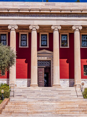 Fototapeta premium Partial view of the columns of Gennadius Library facade. .On the front is written a quote of Isocrates: 