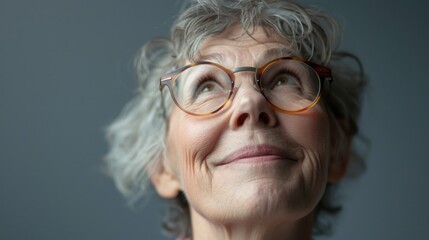 Woman with glasses looking up at the sky, perfect for science or astronomy concepts