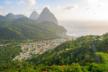 Stunning view of the Pitons (Petit Piton & Gros Piton). from an elevated viewpoint with the rainforest and bay of Soufrire in the foreground...Soufriere,.Saint Lucia, .West Indies, Eastern Caribbean