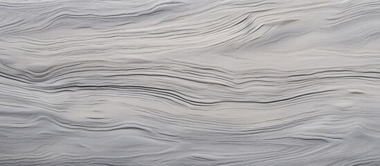 Obraz premium A detailed view of a wave pattern on a Sand Erable veneer wall in grey color, showcasing the intricate design and texture of the surface.