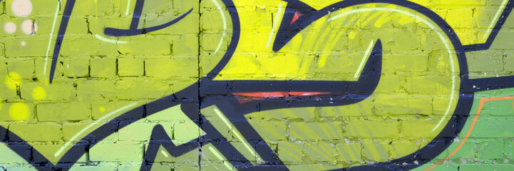 Colorful background of graffiti painting artwork with bright aerosol outlines on wall. Old school...