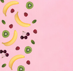 Fruit and berry on the pink background. Flat lay. Pattern. Copy space. Top view.