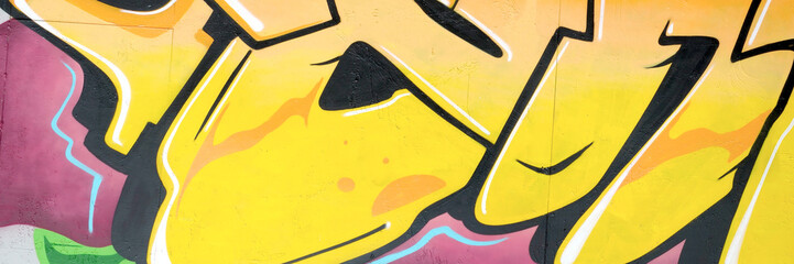 Colorful background of graffiti painting artwork with bright aerosol outlines on wall. Old school...