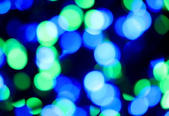 Obraz premium intentionally blurred background of many colorful blue green lights ideal as a backdrop