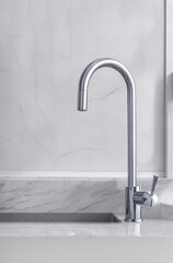 modern design of chrome kitchen faucet close up