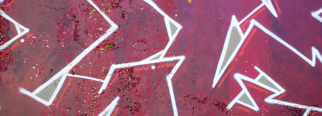 Colorful background of graffiti painting artwork with bright aerosol outlines on wall. Old school...