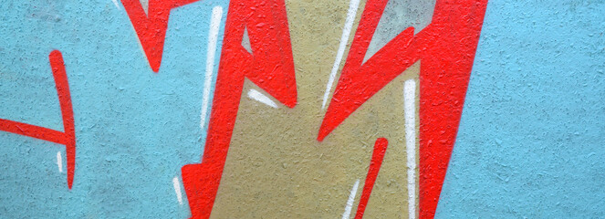 Colorful background of graffiti painting artwork with bright aerosol outlines on wall. Old school...