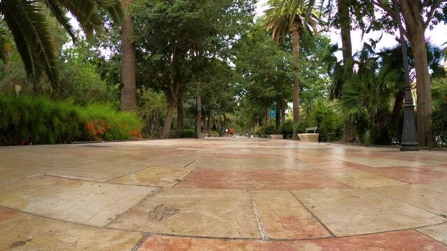Walking in Malaga park near port in the morning in Malaga, Spain