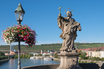 Obraz premium statue of Saint John of Nepomuk on the old bridge in Wurzburg, Germany