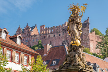 statue of Saint Mary in front of ruined castle in Heidelberg, Germany