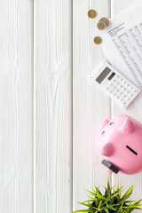 Piggy bank with money and budget taxes calculations and bills. Economy concept