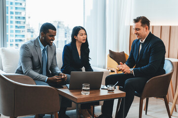 Group of diverse executive investor listening businessman talking about investment. Professional business team discussing about business plan, statistic, marketing strategy at office. Ornamented.