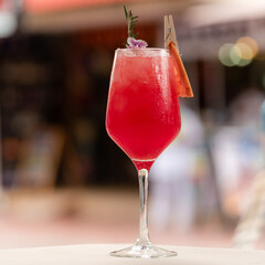 red cocktail on a table
