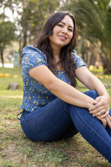 Obraz premium details of young latin woman with short hair wears casual clothes, youth fashion and natural beauty, sunny day and lifestyle in a park with nature