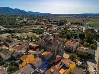Discover the timeless allure of Garriglella medieval heritage showcased in aerial images against...