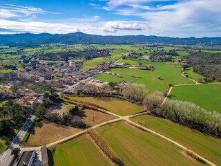 Embark on an aerial adventure above Llagostera and witness the fusion of history and natural beauty...