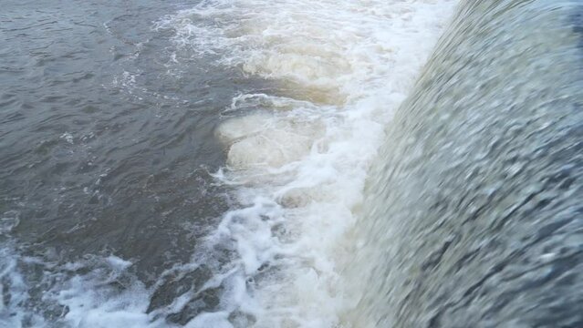 A beautiful waterfall from a check dam at Kerala India. Beautiful view of pure white water flowing through the rocks