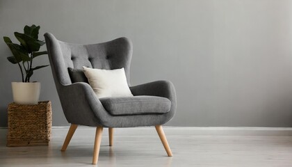comfortable armchair near light grey wall indoors space for text