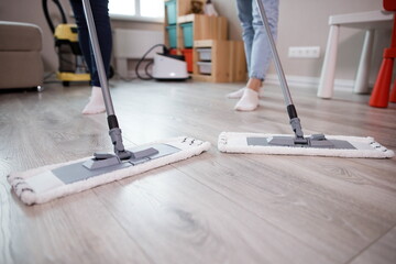 cleaning the house, mopping the floors