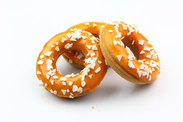 Sweet strawberry glazed donuts with sprinkles on white background, Delicious colorful donuts isolated on white background With clipping path.