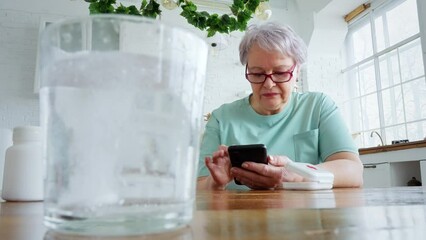 Woman taking pills at home