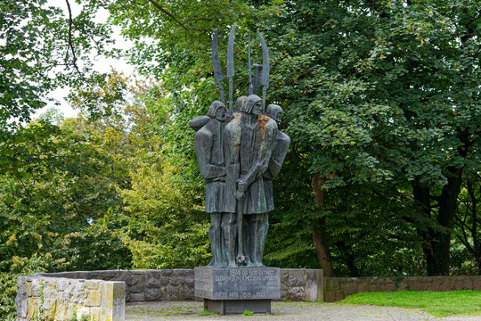 Bronze sculpture named Spomenik kmečkim upornikom by Stojan Batič in memory of Peasant Uprise at castle hill on a cloudy summer day. Photo taken August 9th, 2023, Ljubljana, Slovenia.