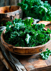 kale cabbage in a plate. Selective focus. - obrazy, fototapety, plakaty