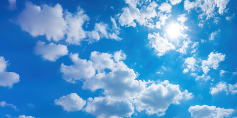 Bright blue sky with puffy white clouds on a clear sunny day
