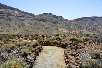 Volcanic landscape with a footpath  in El Teide National Park on Tenerife, Spain