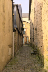 View of a narrow street in a medieval city in the north of France (Vitre, Brittany, France, Europe)