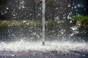 Fountain water shooting up and splashing