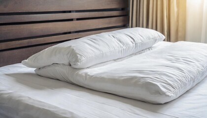 white folded duvet lying on white bed background preparing for winter season household domestic activities hotel or home textile