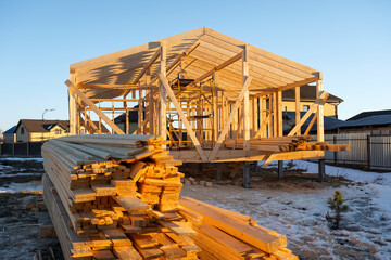 Construction of a wooden frame house - frame from the foundation, walls, roof on stilts is a...