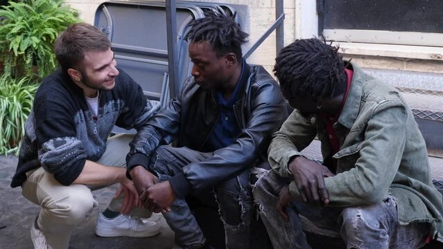 friendship, comfort-depressed young african man is comforted by two friends
