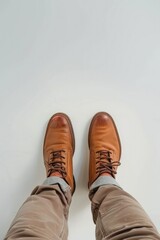 brown men's shoes on a white background