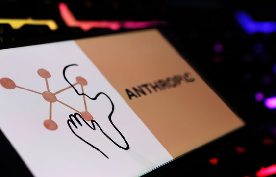 Viersen, Germany - February 9. 2024: Closeup of smartphone with logo lettering of Anthropic AI software company on computer keyboard