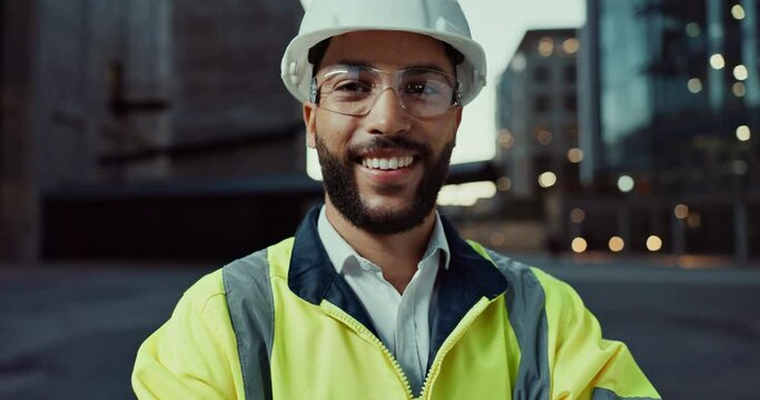 Face, construction site or happy man in city with arms crossed or smile for architecture or building. Engineering labor, night project and portrait of proud builder, confident worker and contractor