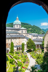 Catacomb Arched Window View of Salzburg Cathedral from St. Peter's - obrazy, fototapety, plakaty