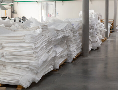 Factory warehouse with new white polypropylene bags ready to ship to customer.