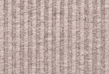 Soft beige color ribbed knit fabric pattern close up as background