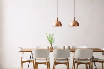 Foto op Plexiglas Copper pendant lights over a wood dining table with white chairs in a minimalist dining room. © camelia